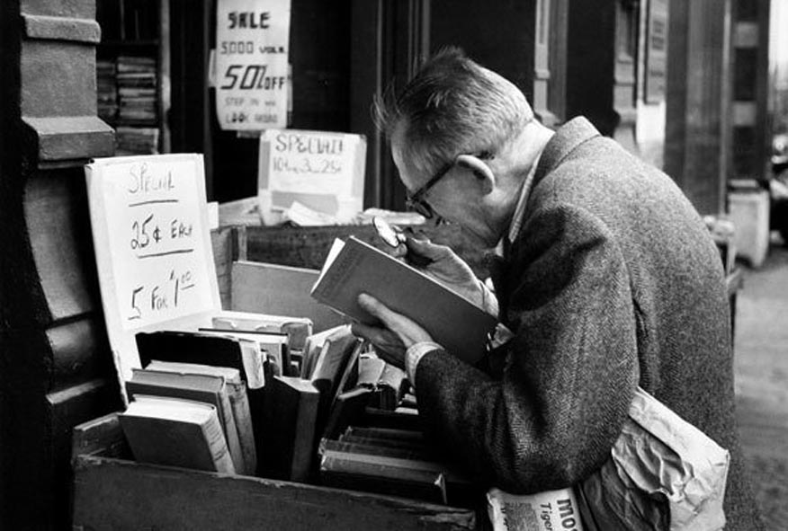 Man Reading with Magnifying Glass, New York, 1959 Photograph: André Kertész/Stephen Bulger gallery